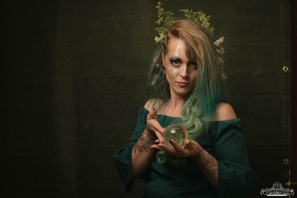 lady holding a crystal ball