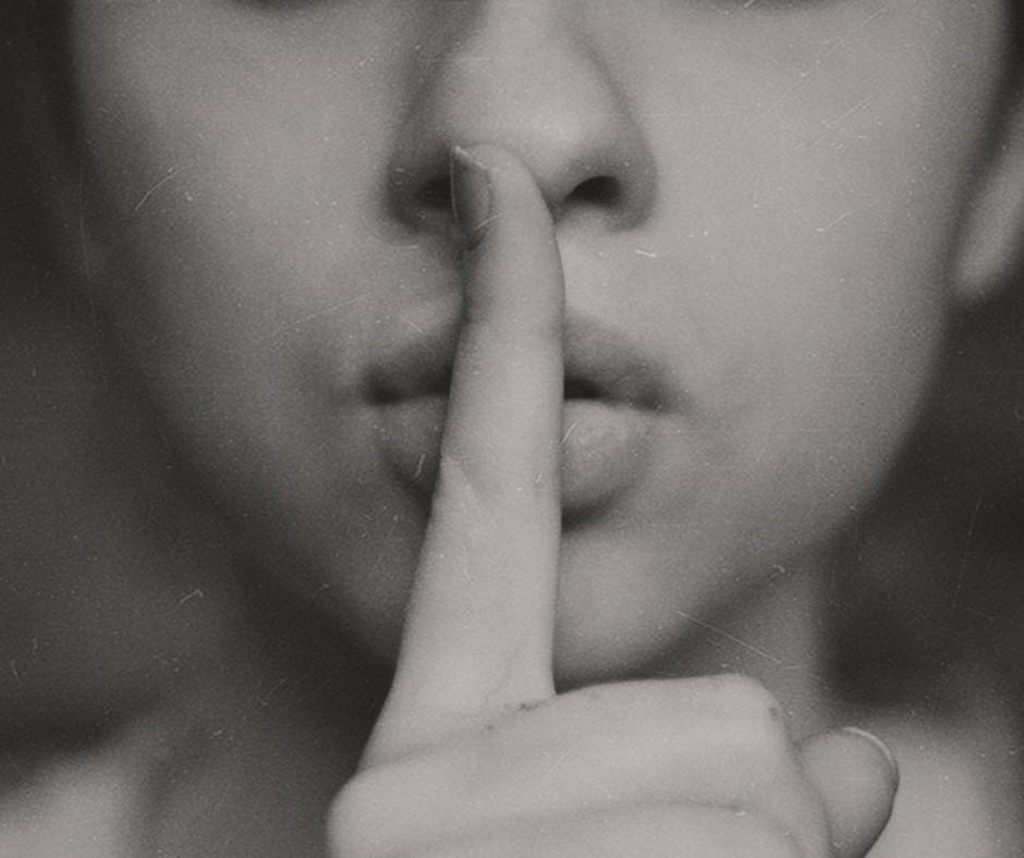 finger up to someones lips, a secret