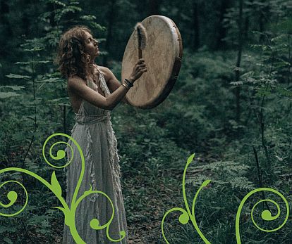 women with hand drum in the woods